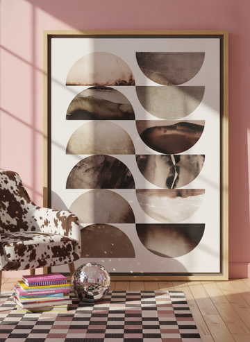 Oversized statement canvas wall art with a natural timber surround leaning against the wall in a colourful eclectic bedroom