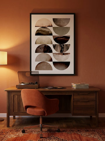 Canvas wall art with a black surround styled on the wall in a retro 70s home office