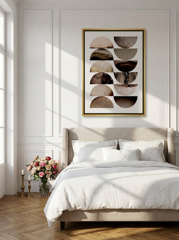Canvas wall art with a gold leaf surround styled on the wall in a Parisian bedroom