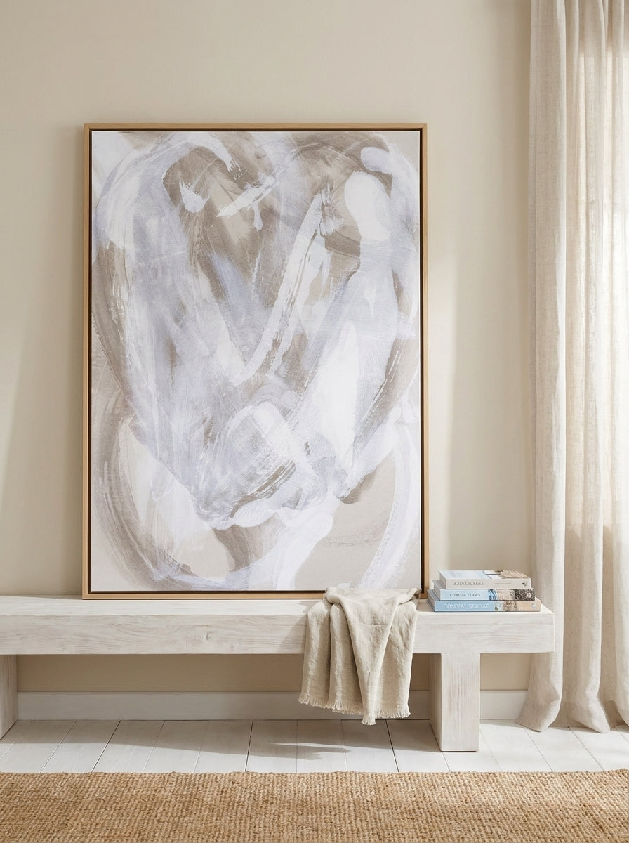 Canvas wall art with a natural timber surround standing on a console in a coastal home office
