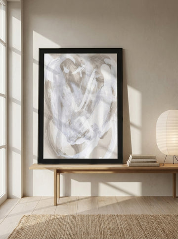 Modern wall art print standing on a bench in a warm Japandi bedroom