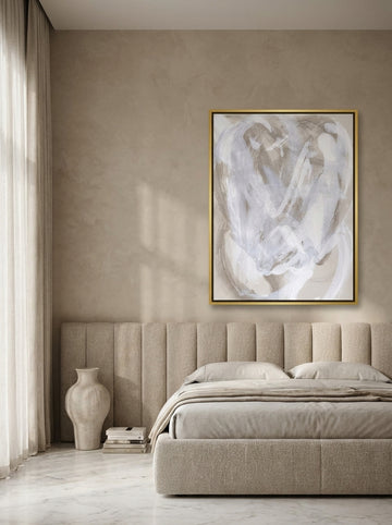 Oversized statement canvas wall art with a gold leaf surround styled on the wall in a luxe bedroom