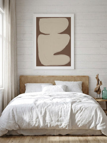 Modern wall art print styled on the wall in a coastal bedroom
