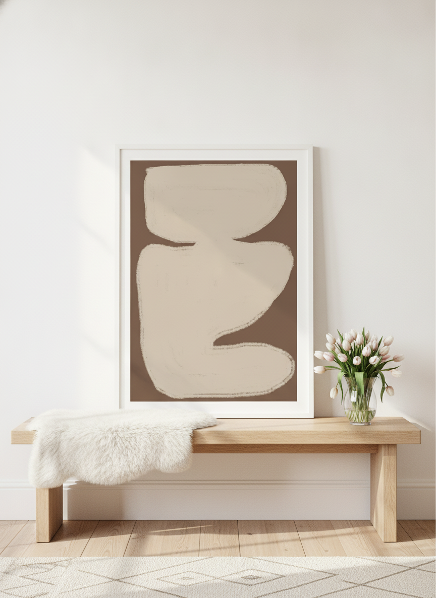 Modern wall art print standing on a bench in a bright Scandinavian home office