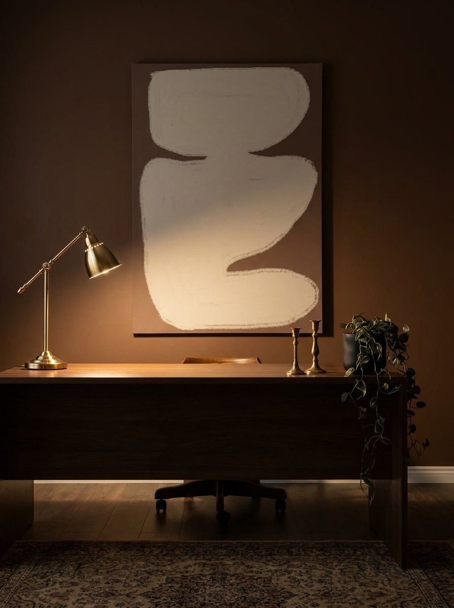 Stretched canvas wall art styled on the wall in a moody home office