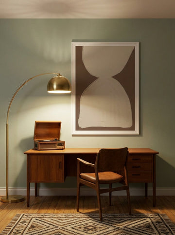Modern wall art print styled on the wall in a mid-century home office