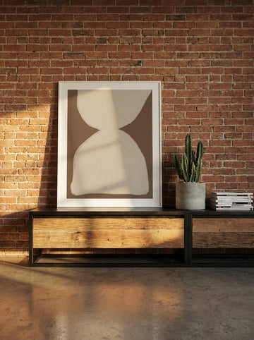 Modern wall art print standing on a console in an industrial loft home office