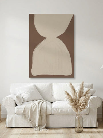 Stretched canvas wall art styled on the wall in a coastal living room