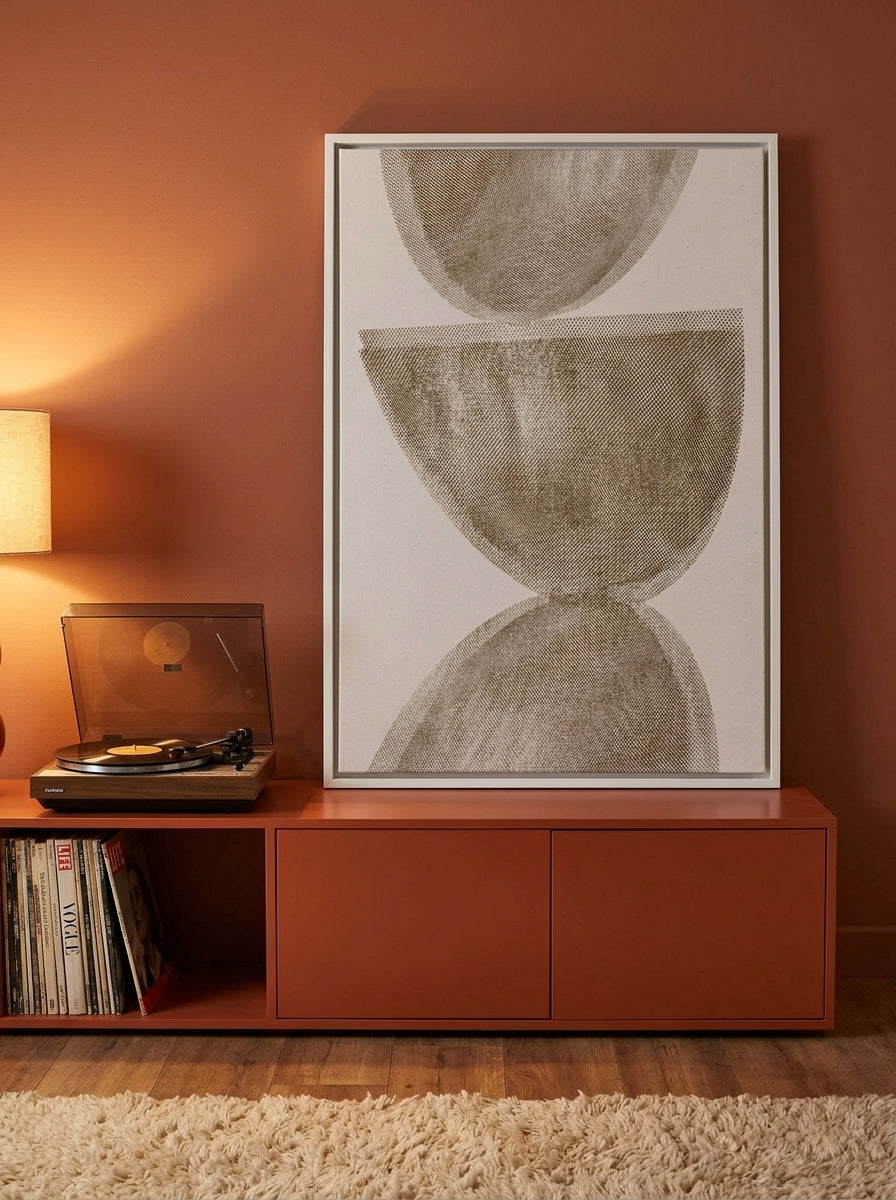 Canvas wall art with a white surround standing on a sideboard in a retro 70s bedroom