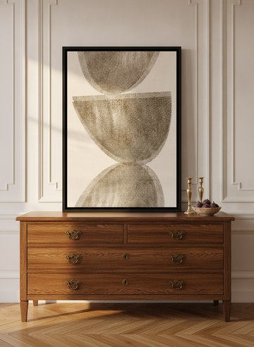 Canvas wall art with a black surround standing on a sideboard in a Parisian living room