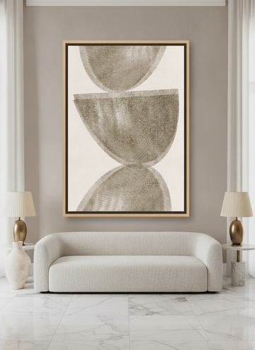 Oversized statement canvas wall art with a natural timber surround styled on the wall in a luxe living room