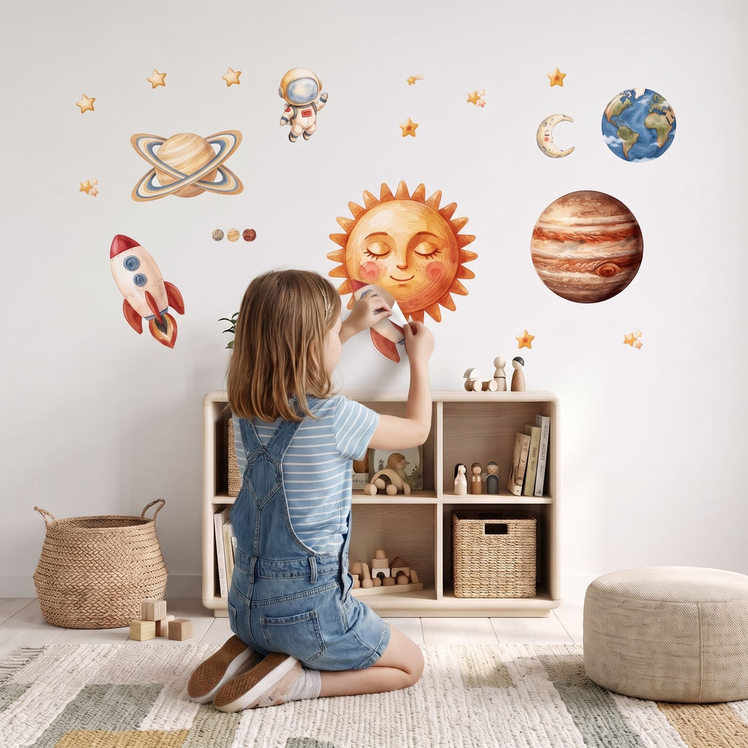 Storybook Solar System Wall Decal Set Wall Sticker Decals wall decals: a girl putting the decals up in a kids' room