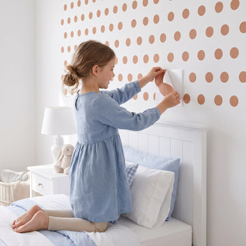 Colour Pop Wall Dots Wall Sticker Decals wall decals: a girl putting the decals up in a girl's bedroom
