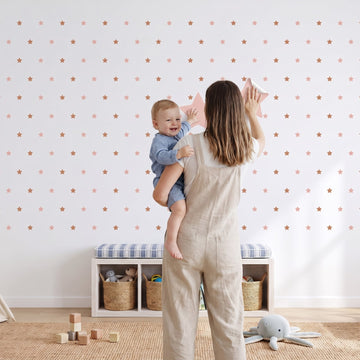 Starry Sky Wall Sticker Decals wall decals: a toddler and their mum putting the decals up in a playroom
