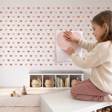 Sweetheart Hearts Wall Sticker Decals wall decals: a girl putting the decals up in a playroom