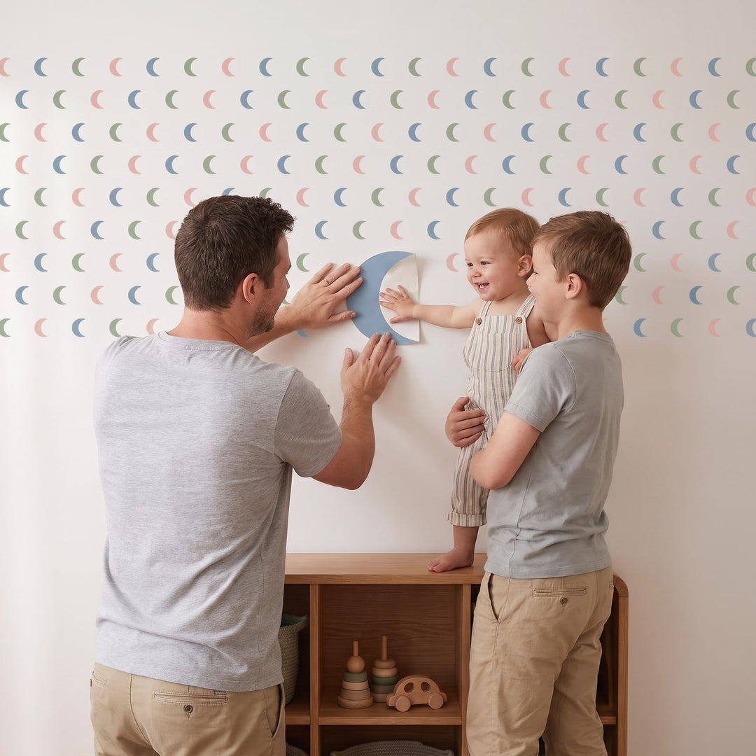Crescent Moon Trio Wall Sticker Decals wall decals: a toddler and their dad putting the decals up in a kids' room