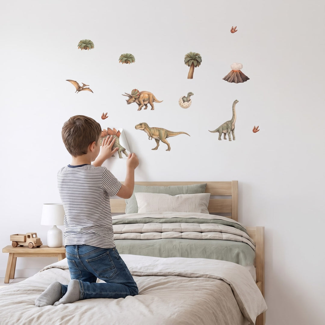 Dinosaur World Wall Sticker Decals wall decals: a boy putting the decals up in a boy's bedroom