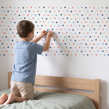 Scattered Dots Wall Sticker Decals wall decals: a boy putting the decals up in a boy's bedroom