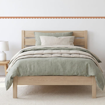 Scallop Border Panels Wall Sticker Decals running across a boy's bedroom wall (in Clay)