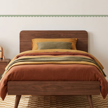 Scallop Border Panels Wall Sticker Decals running across a boy's bedroom wall (in Sage)