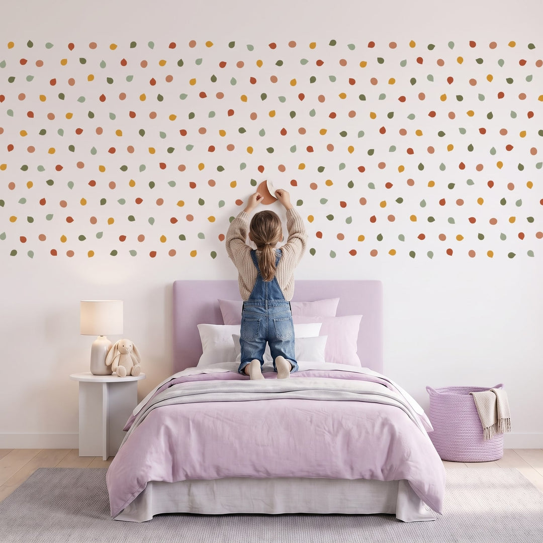 Pebble Dot Wall Sticker Decals wall decals: a girl putting the decals up in a girl's bedroom