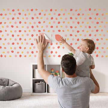 Colour Pop Pebble Dots Wall Sticker Decals wall decals: a toddler and their dad putting the decals up in a kids' room