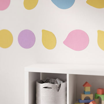 Pastel Pebble Dots Wall Sticker Decals wall decals: a close-up of the decals from one side in a kids' room
