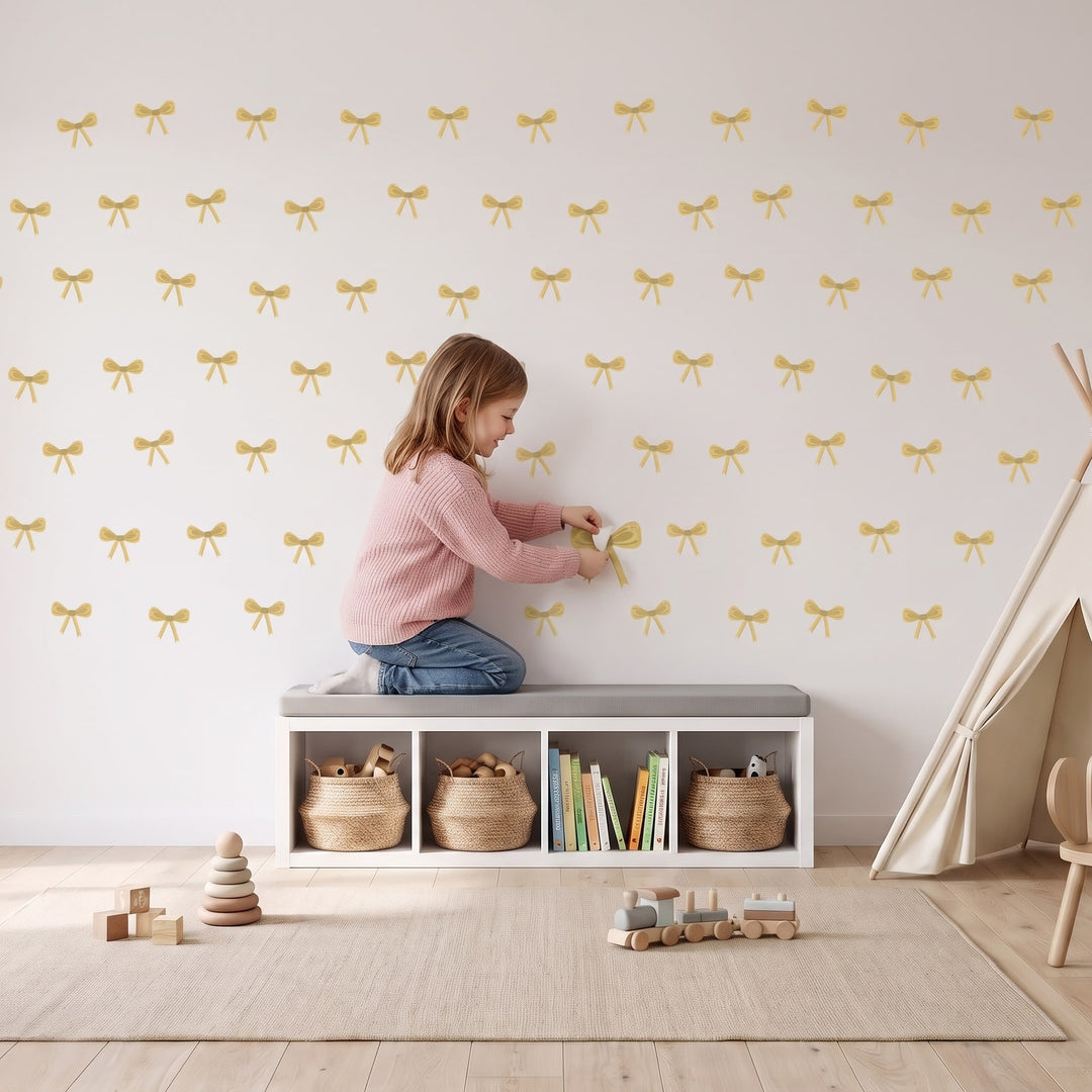 Ribbon Bows Wall Sticker Decals wall decals: a girl putting the decals up in a playroom