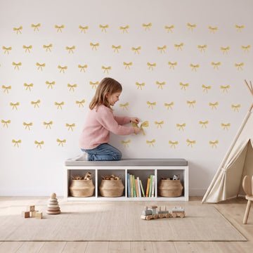 Ribbon Bows Wall Sticker Decals wall decals: a girl putting the decals up in a playroom