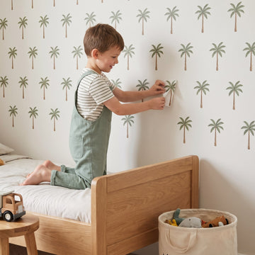 Little Palm Trees Wall Sticker Decals wall decals: a boy putting the decals up in a boy's bedroom