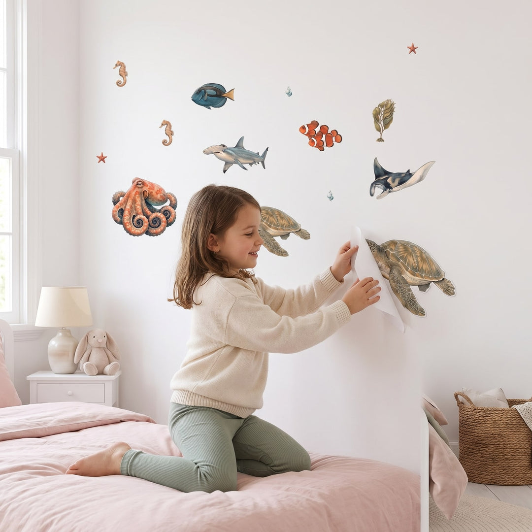 Great Barrier Reef Wall Sticker Decals wall decals: a girl putting the decals up in a girl's bedroom