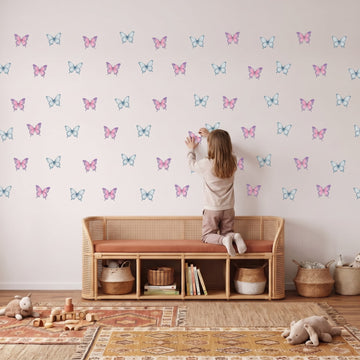 Fairy Floss Lagoon Butterfly Garden Wall Sticker Decals wall decals: a girl putting the decals up in a playroom