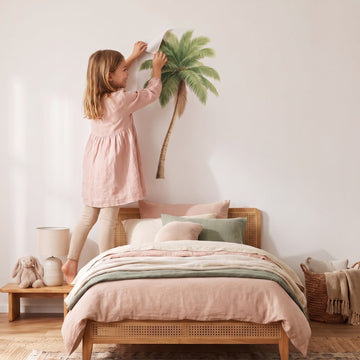 Tall Green Palm Tree Wall Sticker Decals wall decals: a girl putting the decals up in a girl's bedroom