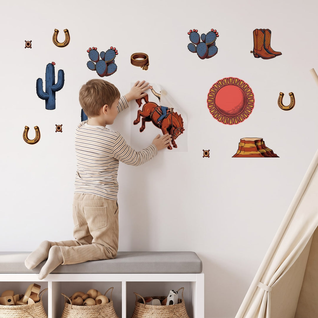 Desert Rodeo Wall Sticker Decals wall decals: a boy putting the decals up in a playroom