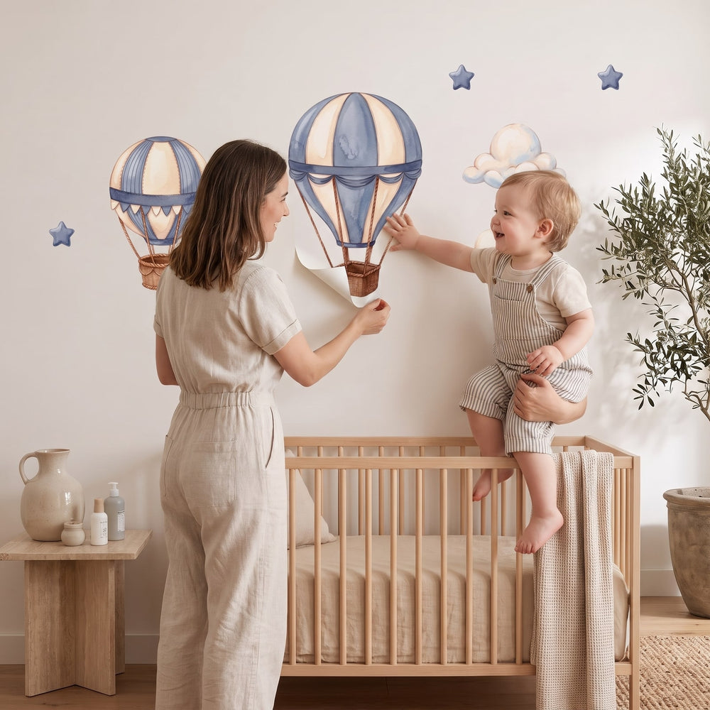 Dusty Blue Hot Air Balloons Wall Sticker Decals wall decals: a toddler and their mum putting the decals up in a nursery