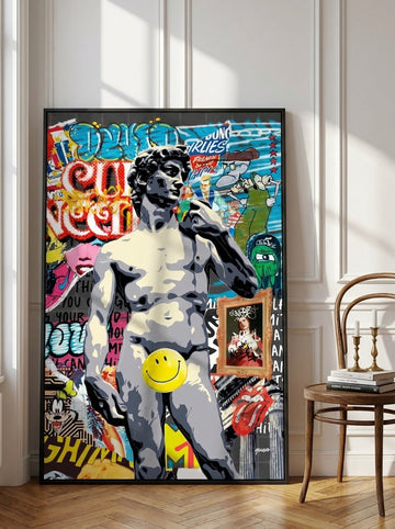 Oversized statement canvas wall art with a black surround leaning against the wall in a Parisian living room