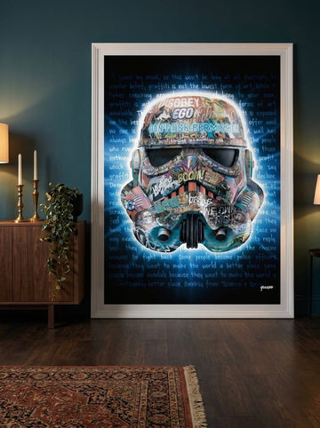 Modern wall art print standing on a sideboard in a moody home office