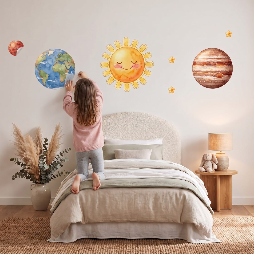 Storybook Solar System Wall Sticker Decals wall decals: a girl putting the decals up in a girl's bedroom