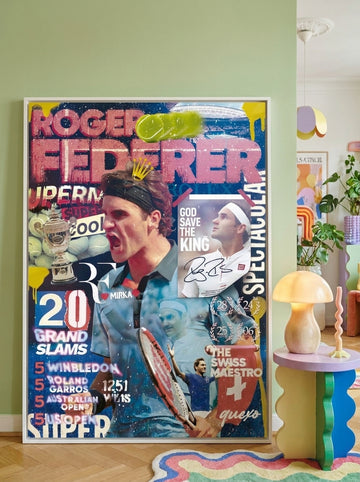 Oversized statement canvas wall art with a white surround leaning against the wall in a colourful eclectic living room