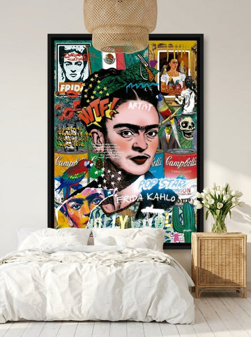 Canvas wall art with a black surround styled on the wall in a bright Scandinavian bedroom