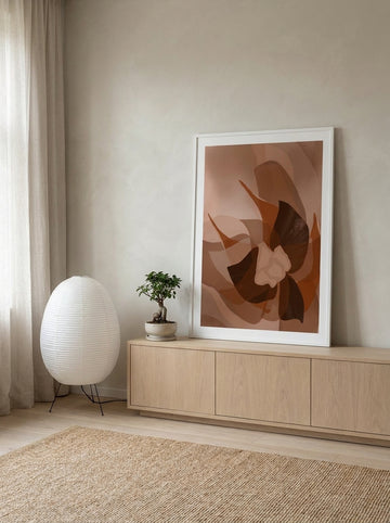 Modern wall art print standing on a sideboard in a warm Japandi home office