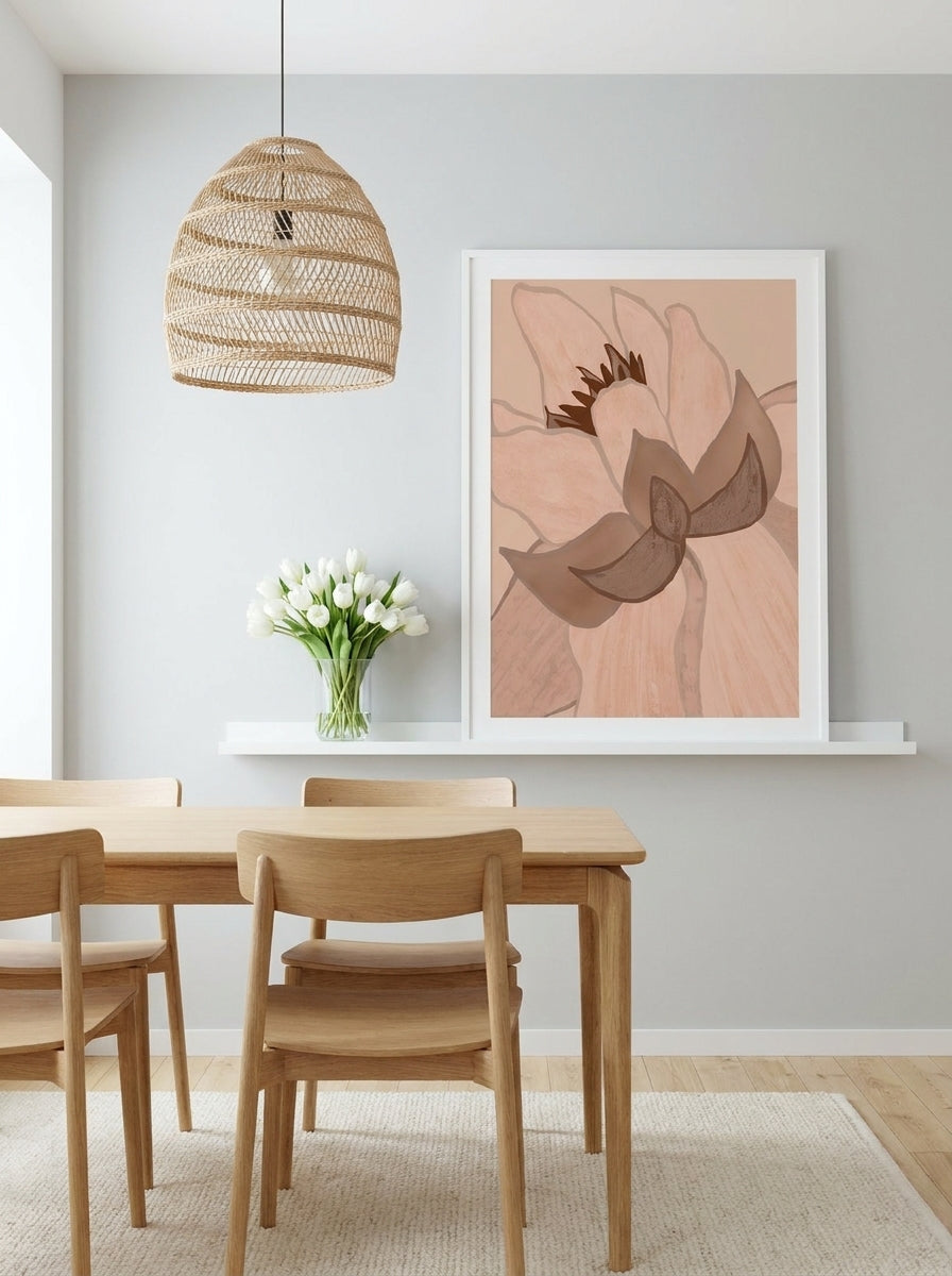 Modern wall art print standing on a shelf in a bright Scandinavian dining room