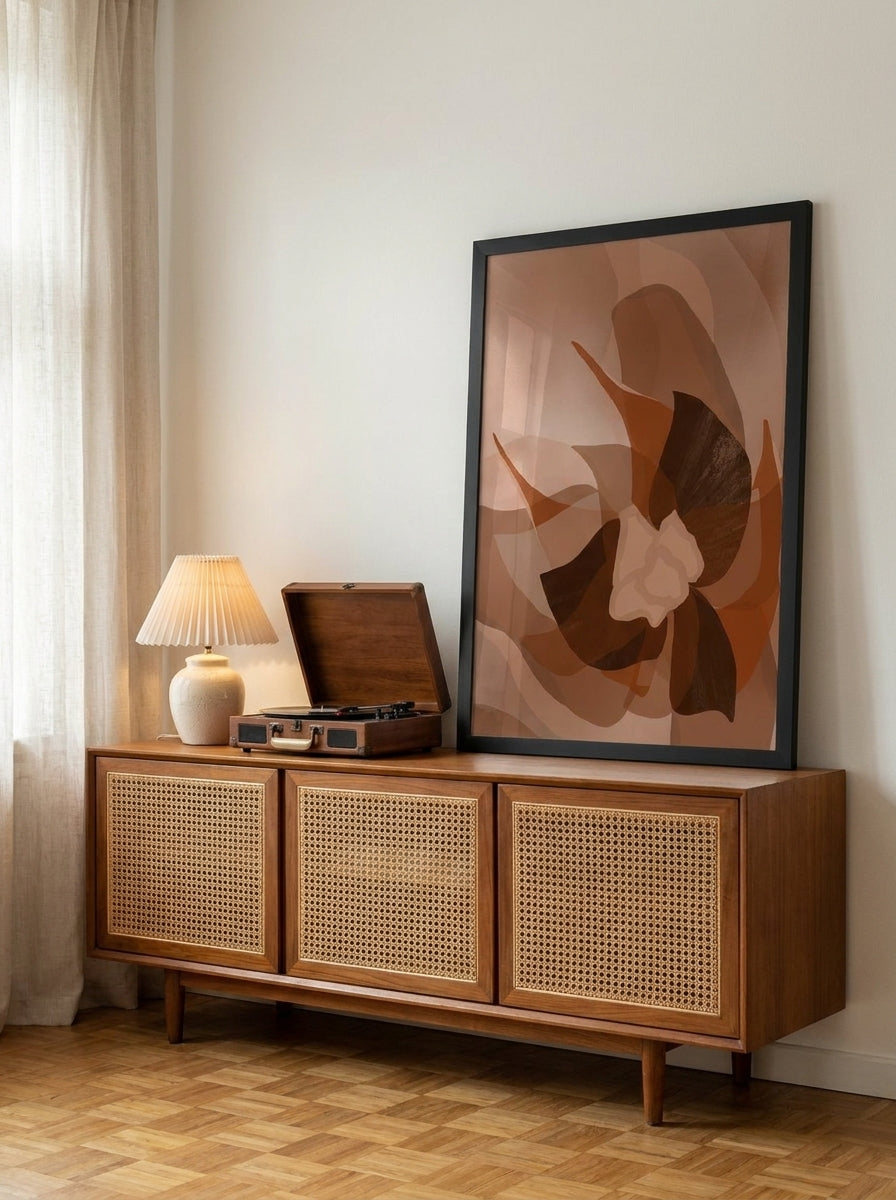 Modern wall art print standing on a sideboard in a mid-century living room