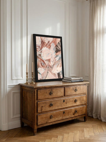 Modern wall art print standing on a sideboard in a Parisian bedroom
