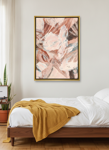 Canvas wall art with a gold leaf surround styled on the wall in a mid-century bedroom