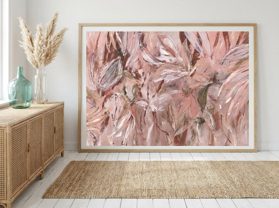 Modern wall art print standing on a sideboard in a coastal dining room