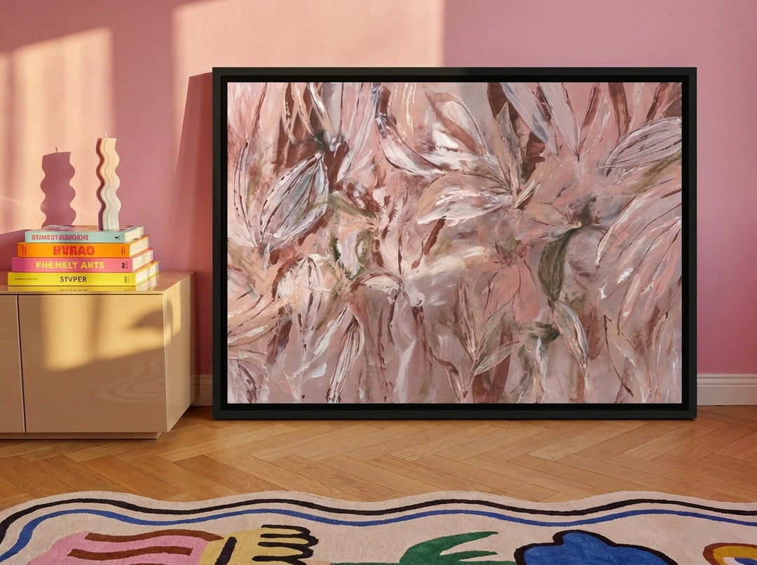 Canvas wall art with a black surround standing on a sideboard in a colourful eclectic living room