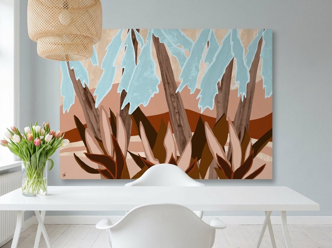 Stretched canvas wall art styled on the wall in a bright Scandinavian home office