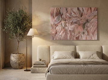 Stretched canvas wall art styled on the wall in a luxe bedroom