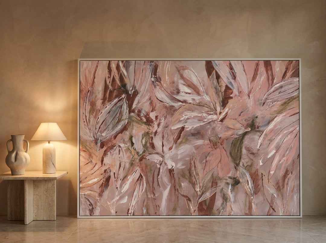 Oversized statement modern wall art print leaning against the wall in a luxe living room